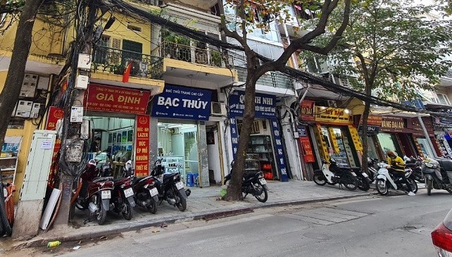 Hang Bac Street view but motorbikes parked outside the jewellery shops