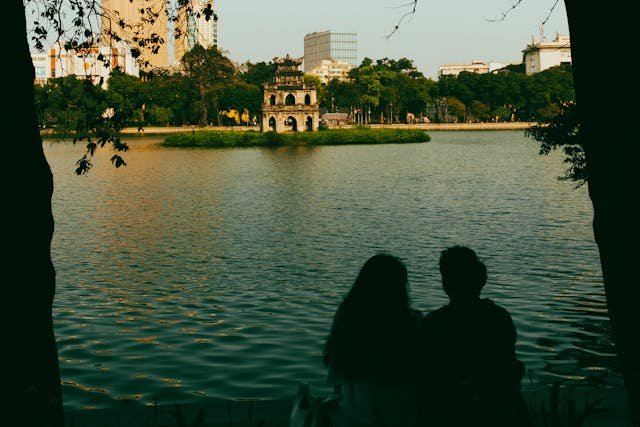 A Couple Sitting by the Hoan Kiem Lake