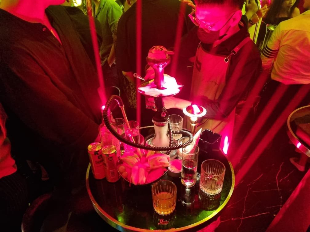 drinks on table with red neon lights