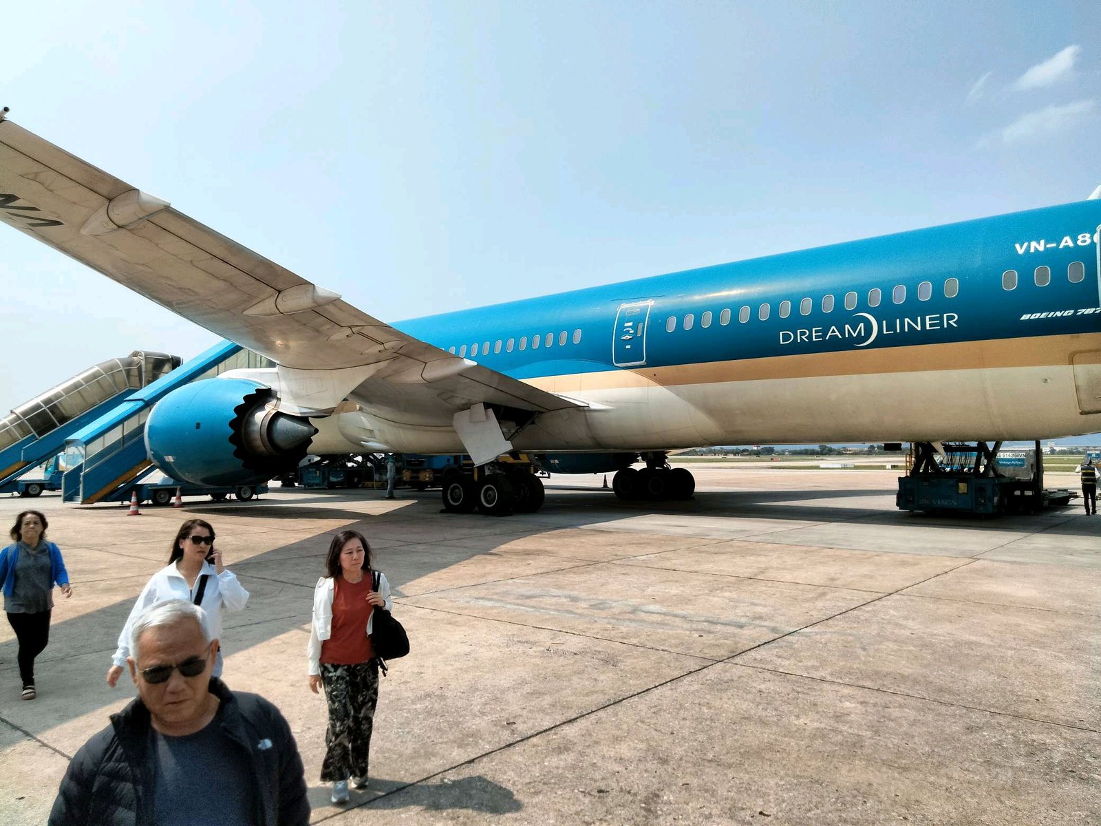 Person exiting the Vietnam Airline plane